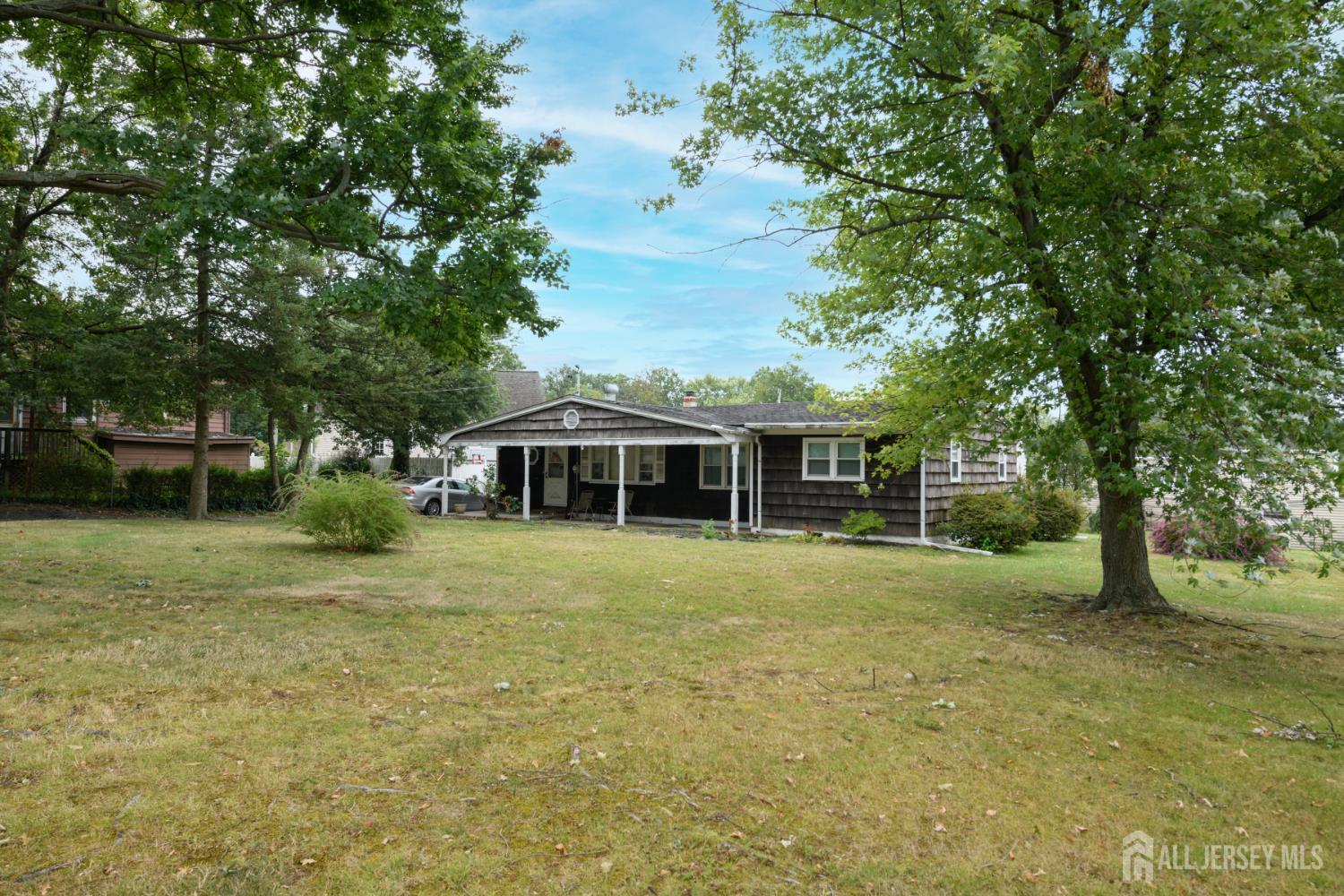 110 Sheppard Place Fords, NJ 08863 - Photo 25 of 34 a front view of a house with a garden