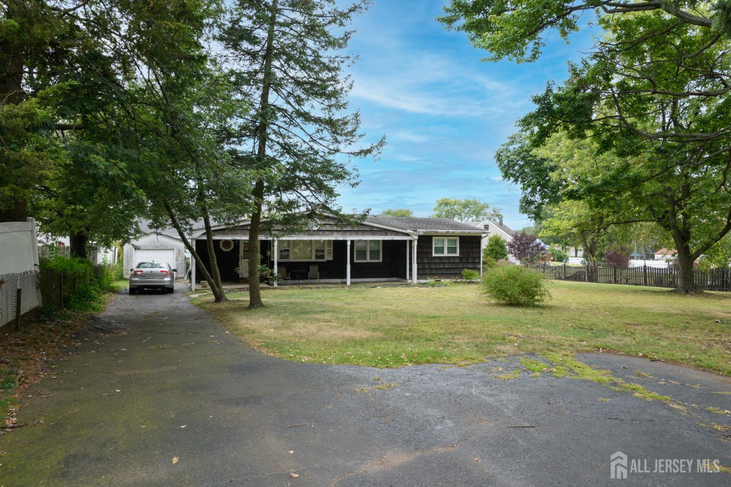 110 Sheppard Place Fords, NJ 08863 - Photo 26 of 34 a front view of a house with a garden