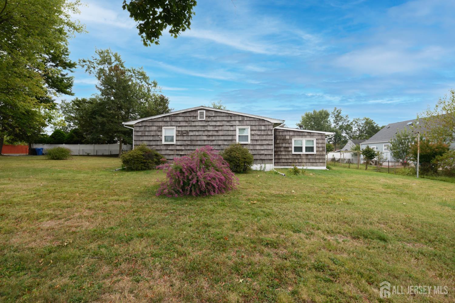 110 Sheppard Place Fords, NJ 08863 - Photo 5 of 34 a view of a garden with a building in the background