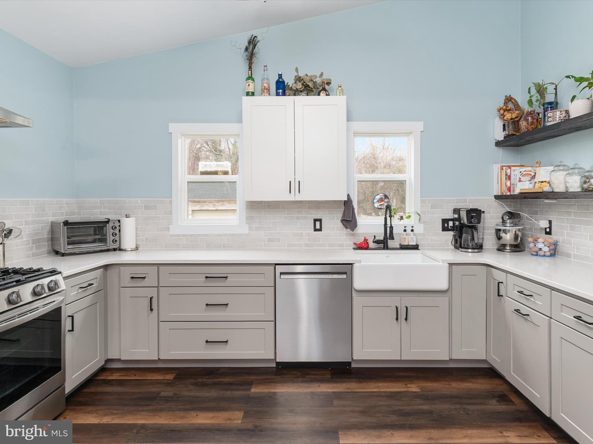 9 Lexington Road Harmans, MD 21077 - Photo 11 of 41 a kitchen with white cabinets stainless steel appliances and sink