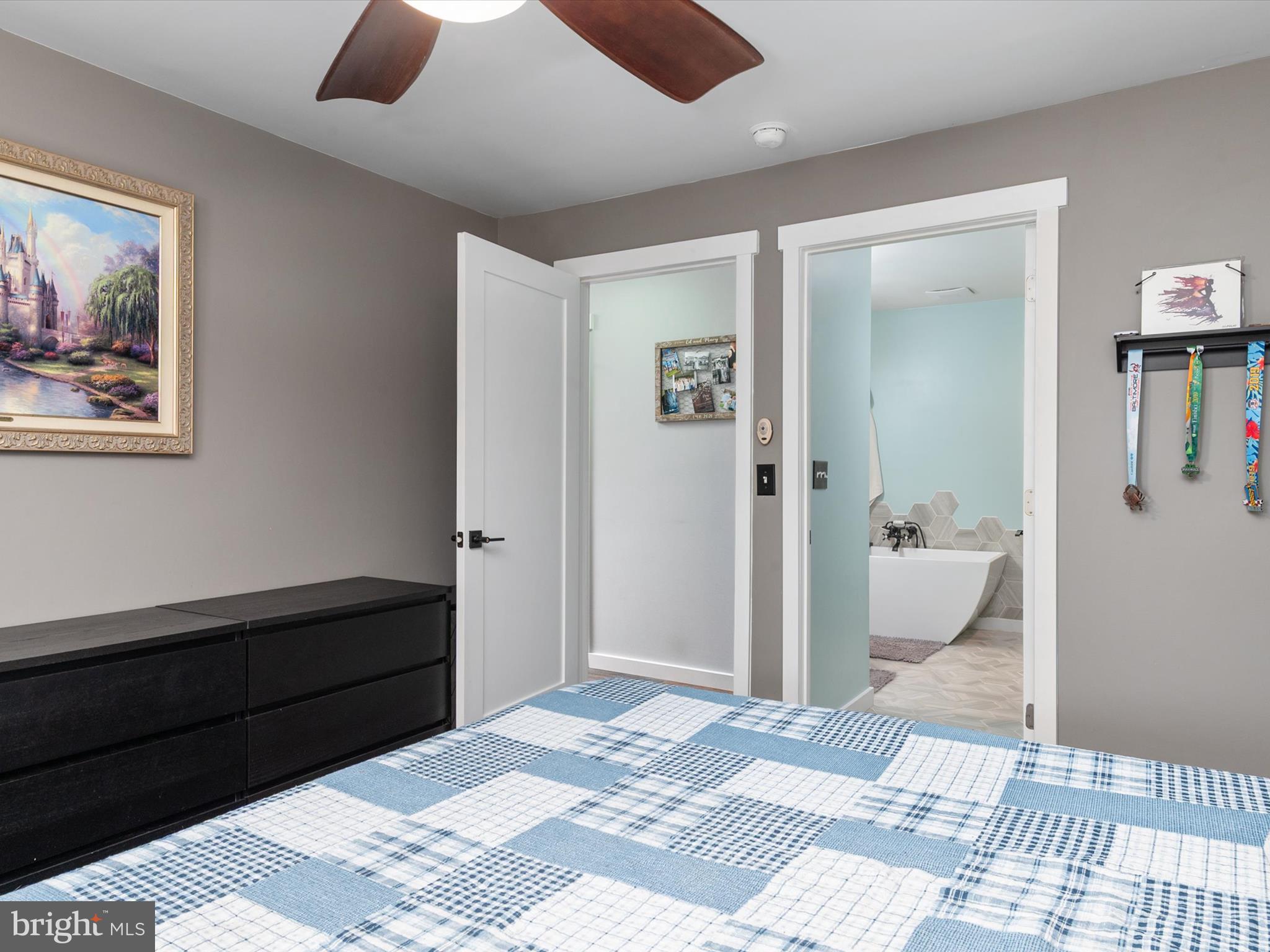 9 Lexington Road Harmans, MD 21077 - Photo 19 of 41 a bedroom with a bed and a painting on the wall