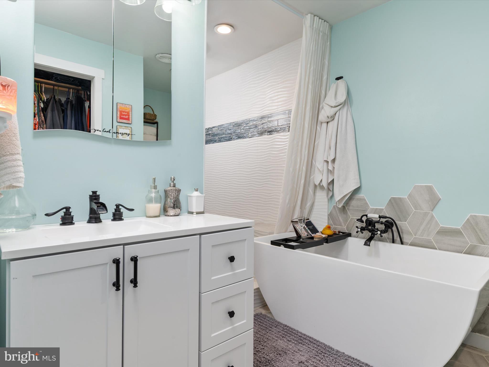 9 Lexington Road Harmans, MD 21077 - Photo 20 of 41 a bathroom with a sink and a mirror