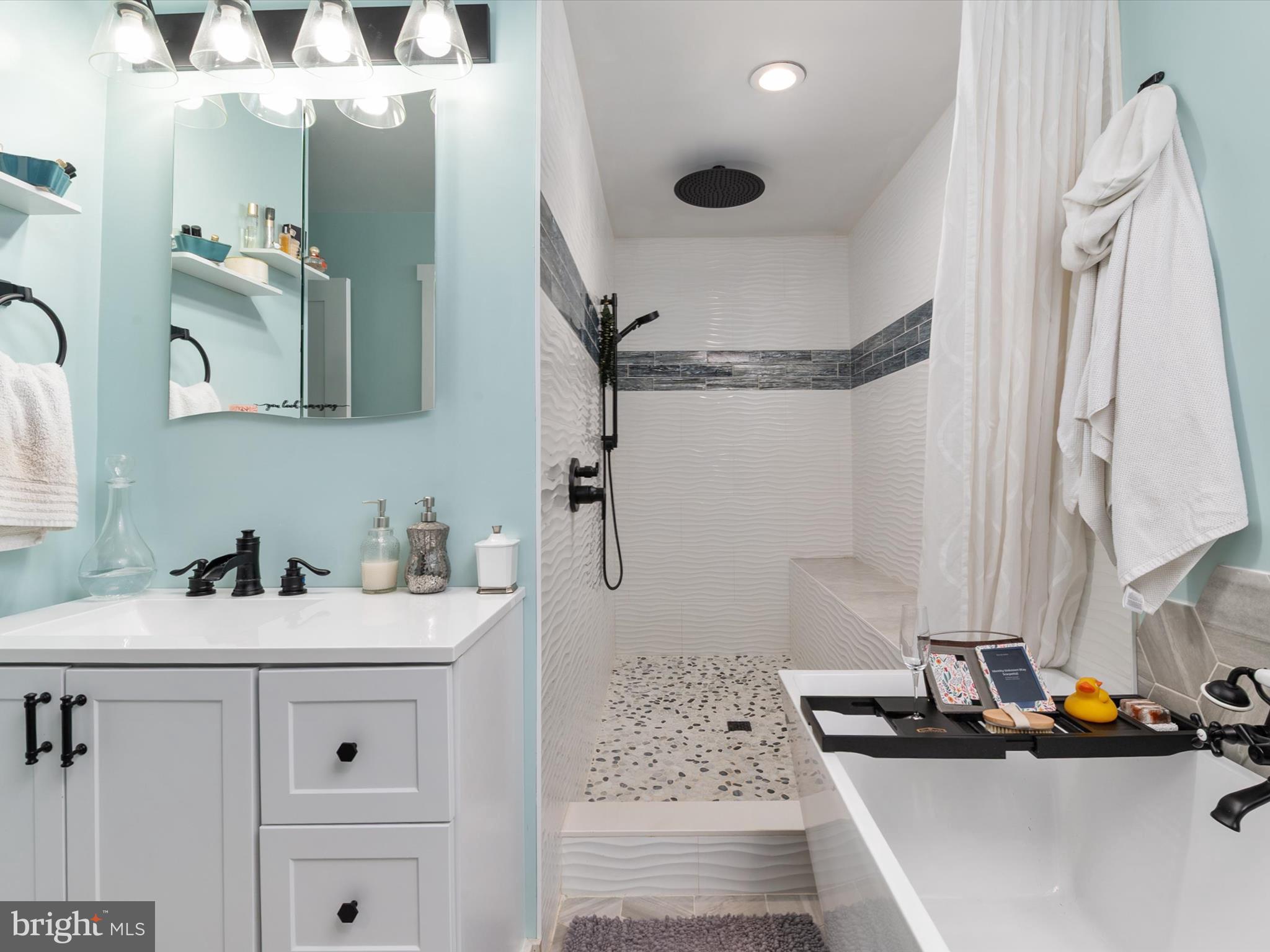 9 Lexington Road Harmans, MD 21077 - Photo 21 of 41 a bathroom with a sink and a mirror