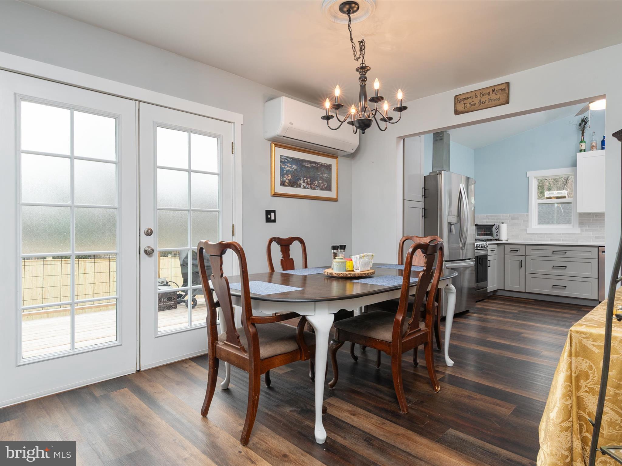 9 Lexington Road Harmans, MD 21077 - Photo 5 of 41 a view of a dining room with furniture window and wooden floor
