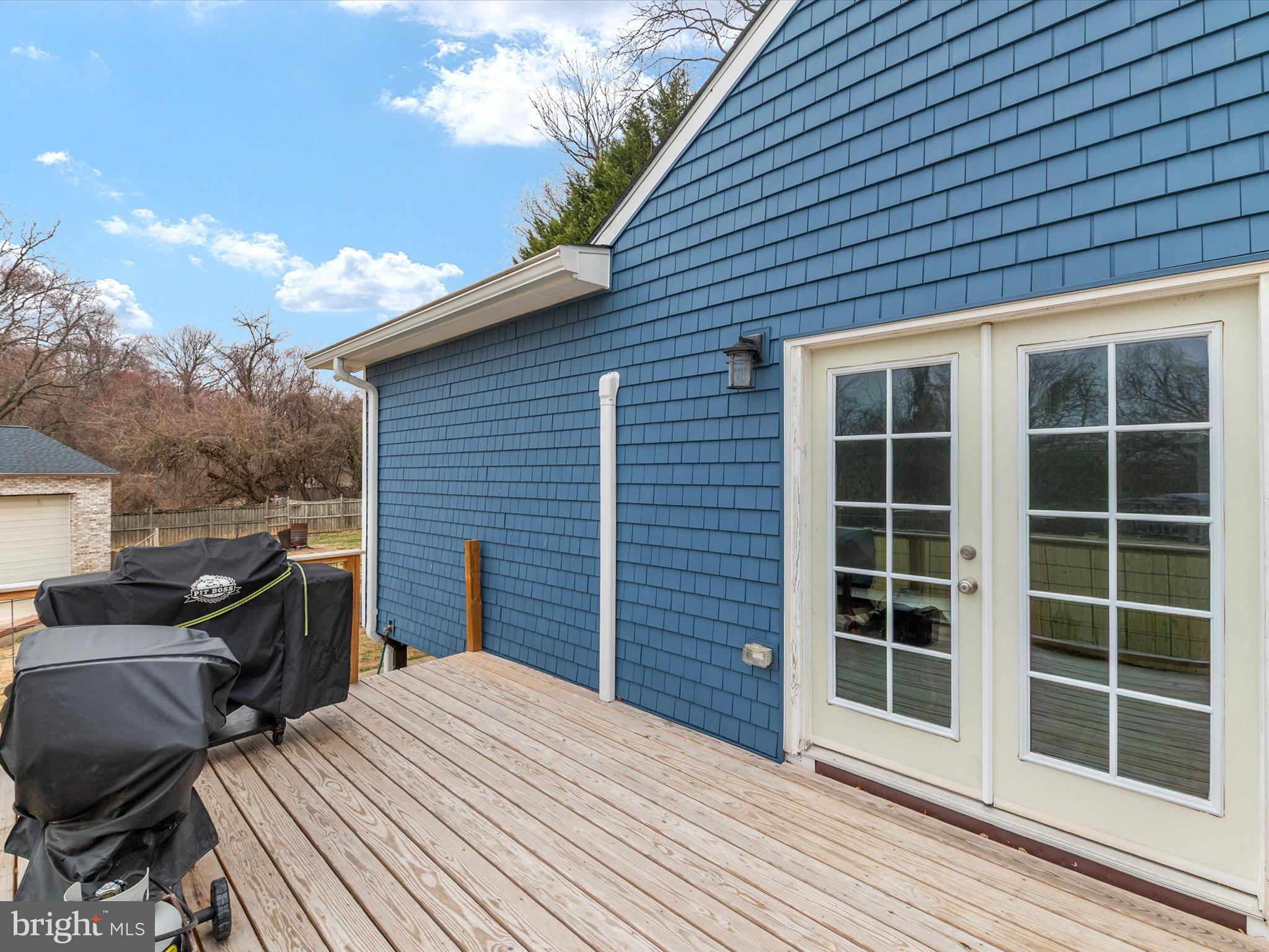 9 Lexington Road Harmans, MD 21077 - Photo 7 of 41 a view of a deck with wooden floor and fence