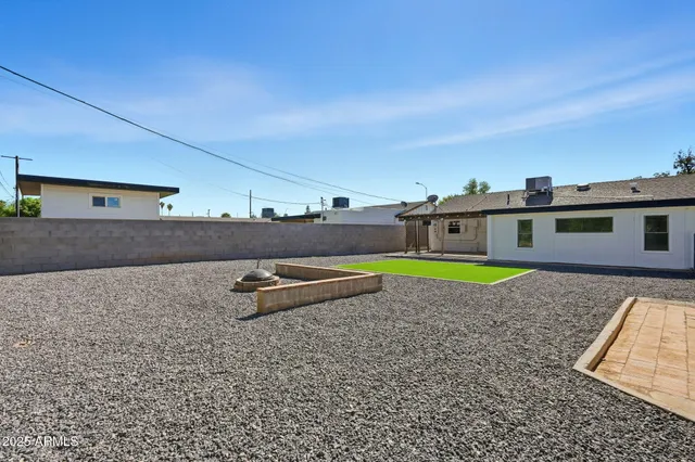 a view of a workspace with furniture and wooden floor