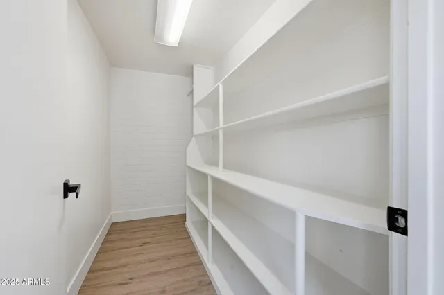 a view of an empty walk in closet