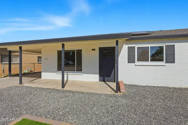 a house view with a backyard space