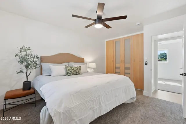 a bedroom with a bed and a couch