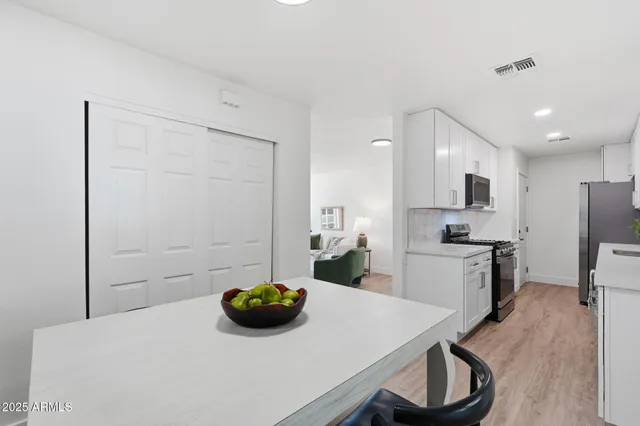 a kitchen with a sink a stove and refrigerator