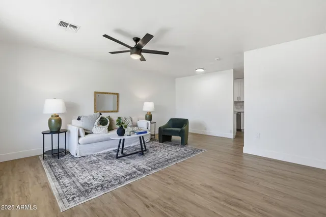 a kitchen with a sink a stove and cabinets