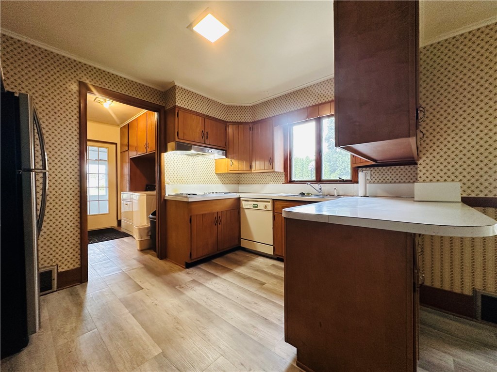 263 East Genesee Street Auburn, NY 13021 - Photo 17 of 50 The kitchen area with the laundry room and back en