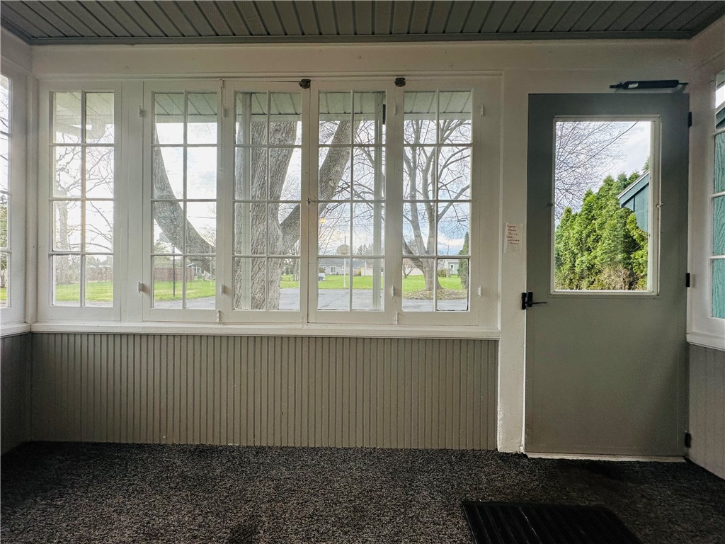 263 East Genesee Street Auburn, NY 13021 - Photo 22 of 50 The enclosed back porch and the door to the back p