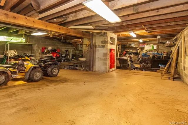 a view of a garage with a bike and wooden roof