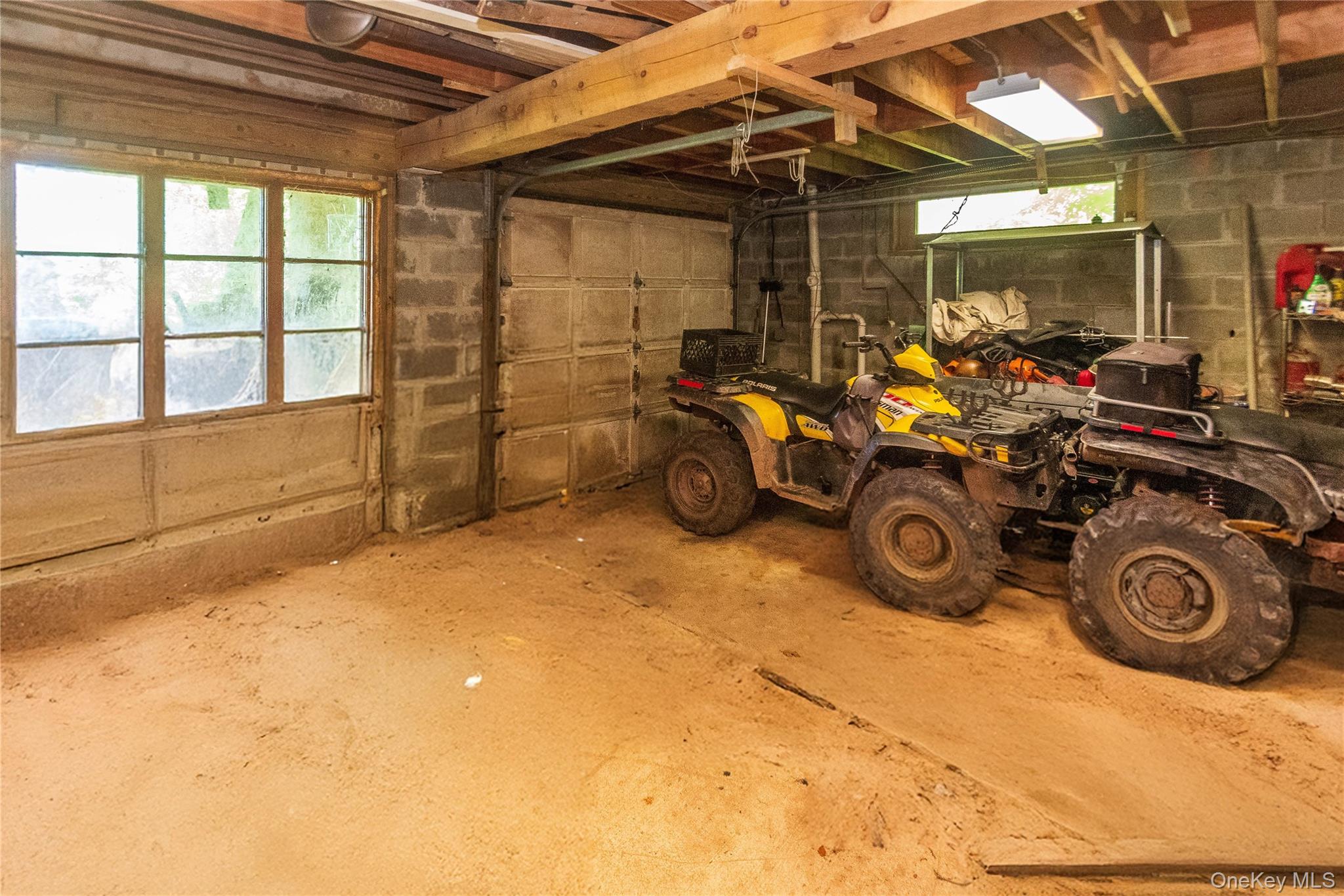 885 Grandview Road Hancock, NY 13783 - Photo 12 of 45 a view of a garage with a bike and wooden roof