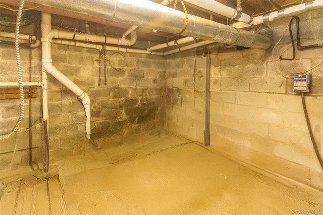 a utility room with multiple dryer and washer
