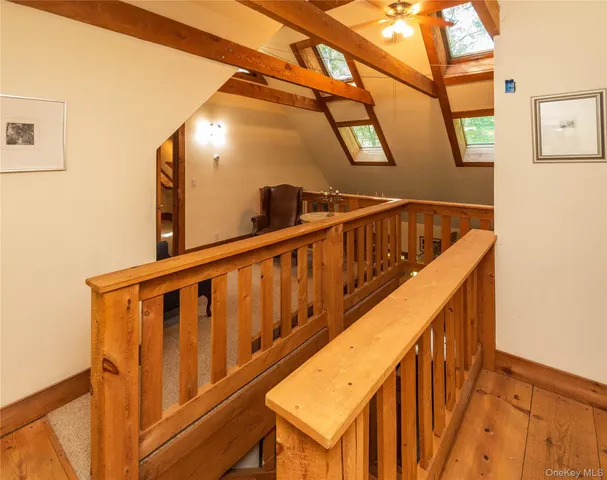 a view of a livingroom with furniture and staircase