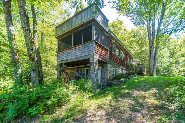 a backyard of a house with lots of green space