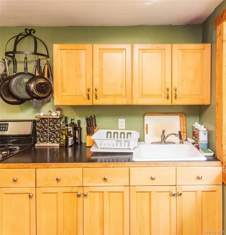 a kitchen with stainless steel appliances granite countertop a stove and a refrigerator