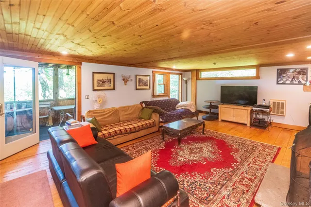 a view of a patio with table and chairs barbeque grill with wooden fence