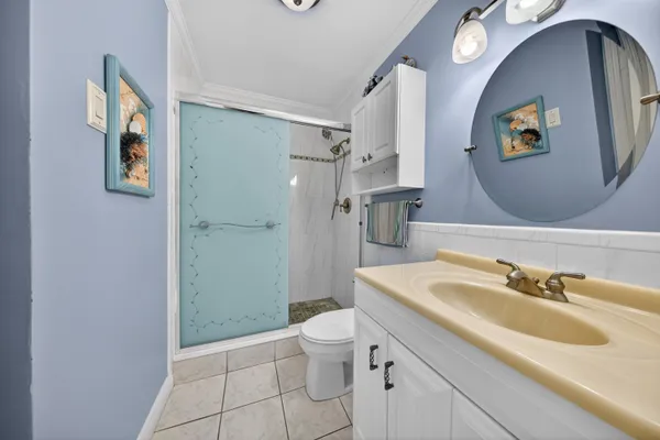 a bathroom with a sink and mirror with toilet