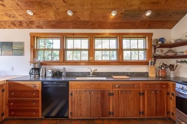 a kitchen with a sink and cabinets