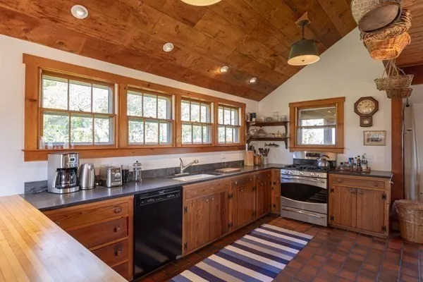 a kitchen with lots of counter top space and stove