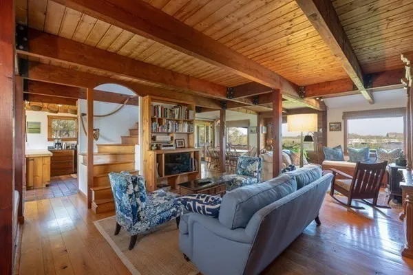 a outdoor living space with patio furniture and wooden floor