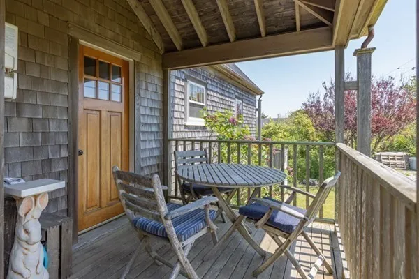 a view of a balcony with furniture