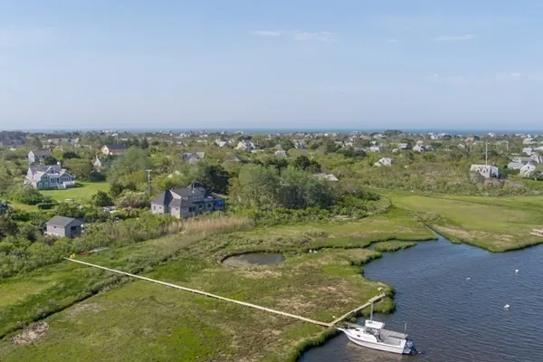 a view of a field with an ocean
