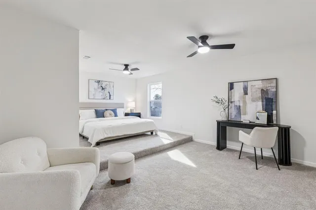 a bedroom with a bed and a couch