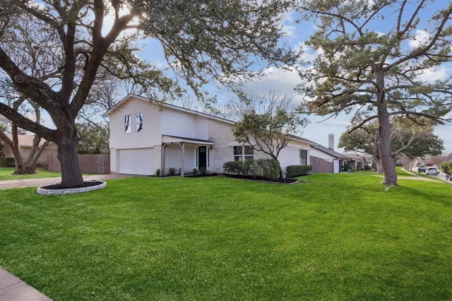 a house view with a garden space