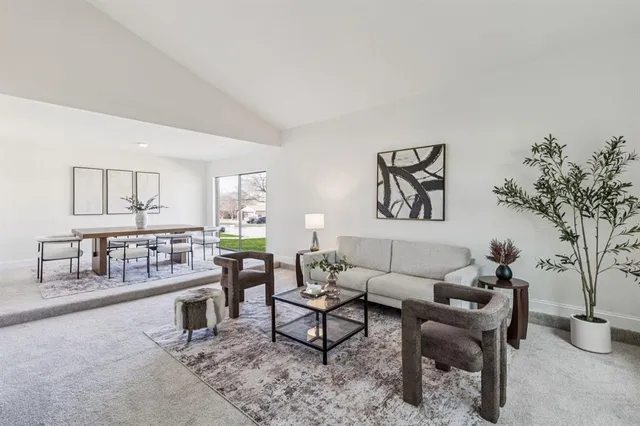 a living room with furniture and a table