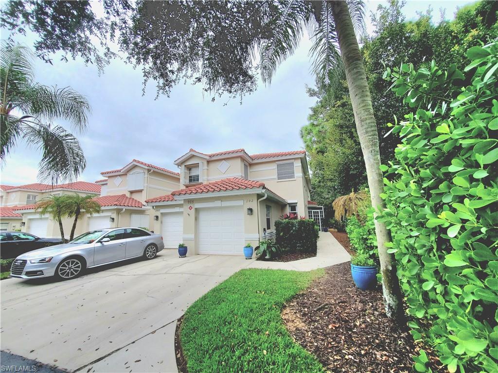 925 Eastham Way, Unit J102 Naples, FL 34104 - Photo 1 of 13 a car parked in front of white house