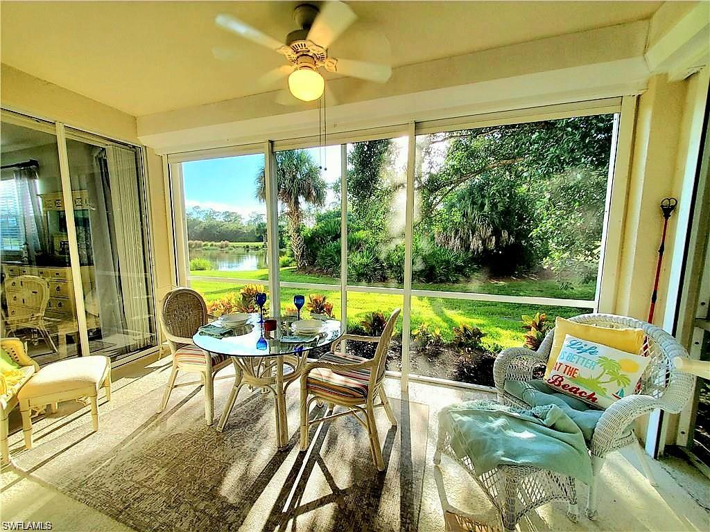 925 Eastham Way, Unit J102 Naples, FL 34104 - Photo 5 of 13 a view of a swimming pool with a patio