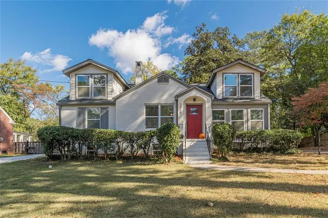 a front view of a house with a yard