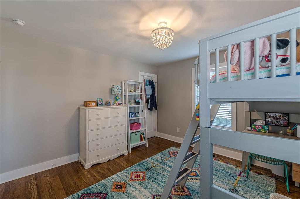 3424 Old Jonesboro Road Atlanta, GA 30354 - Photo 32 of 75 a view of a bedroom with baby crib and furniture