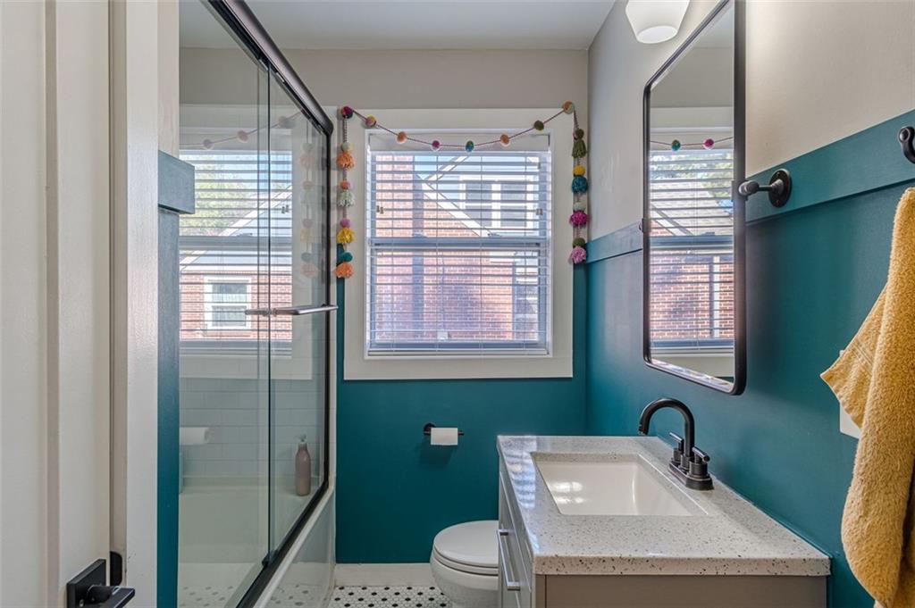 3424 Old Jonesboro Road Atlanta, GA 30354 - Photo 34 of 75 a bathroom with a sink a toilet and shower