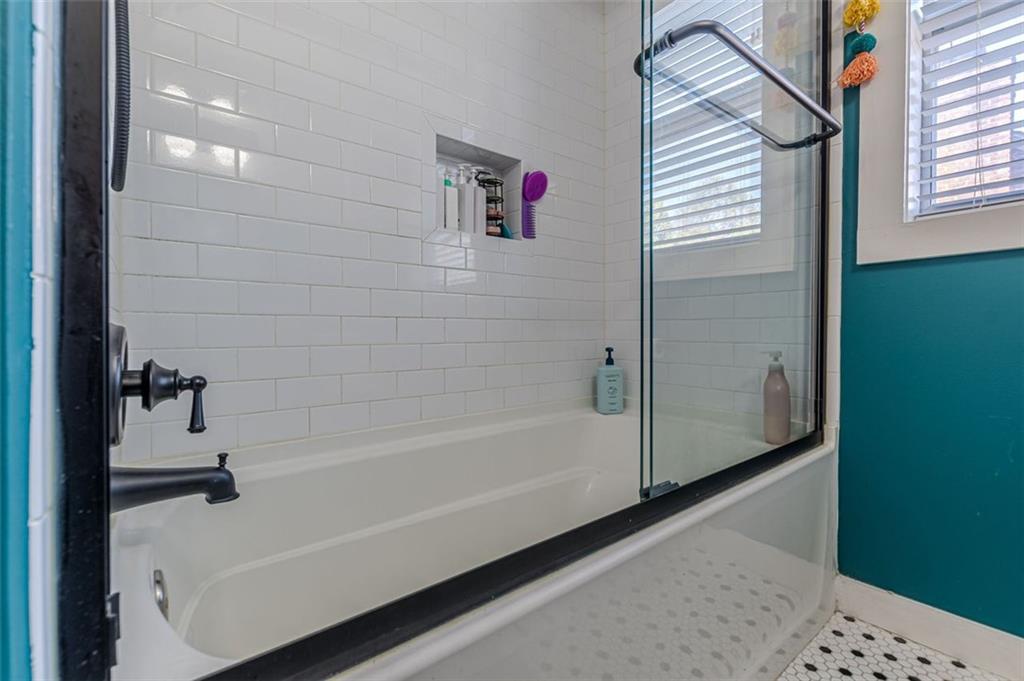 3424 Old Jonesboro Road Atlanta, GA 30354 - Photo 36 of 75 a bathroom with a bathtub and a shower
