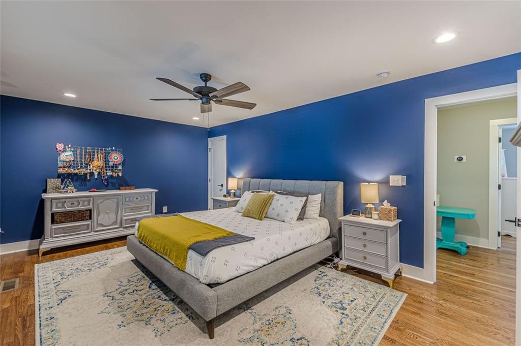 3424 Old Jonesboro Road Atlanta, GA 30354 - Photo 38 of 75 a bedroom with a bed and a chandelier