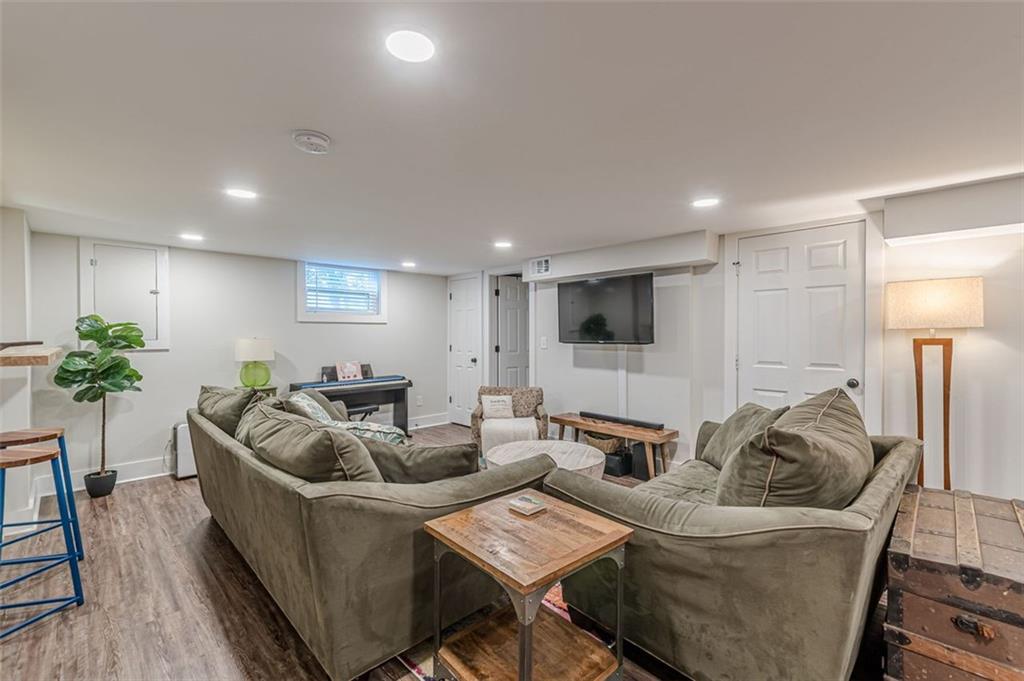 3424 Old Jonesboro Road Atlanta, GA 30354 - Photo 63 of 75 a living room with furniture and a flat screen tv