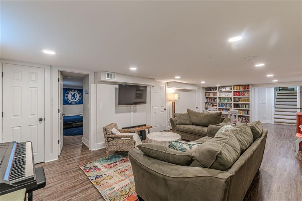 3424 Old Jonesboro Road Atlanta, GA 30354 - Photo 66 of 75 a living room with furniture and a flat screen tv
