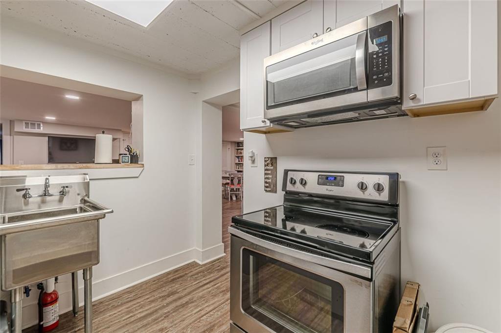 3424 Old Jonesboro Road Atlanta, GA 30354 - Photo 69 of 75 a kitchen with a stove and a microwave
