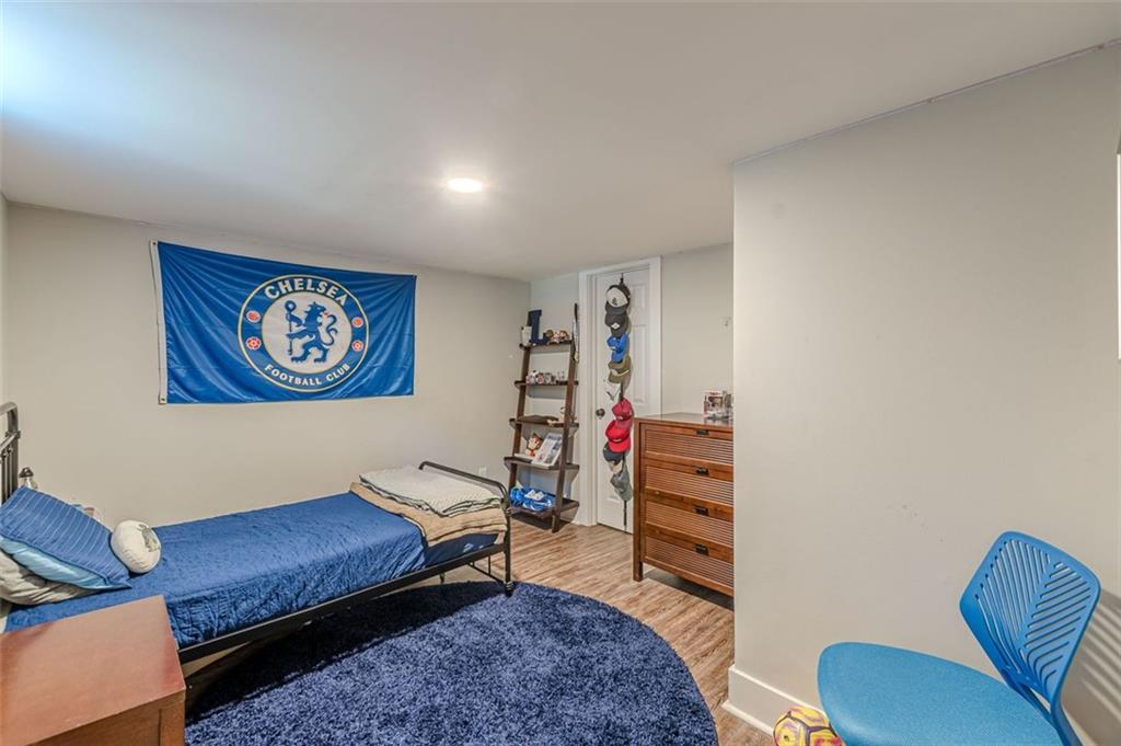 3424 Old Jonesboro Road Atlanta, GA 30354 - Photo 70 of 75 a living room with furniture and a bookshelf