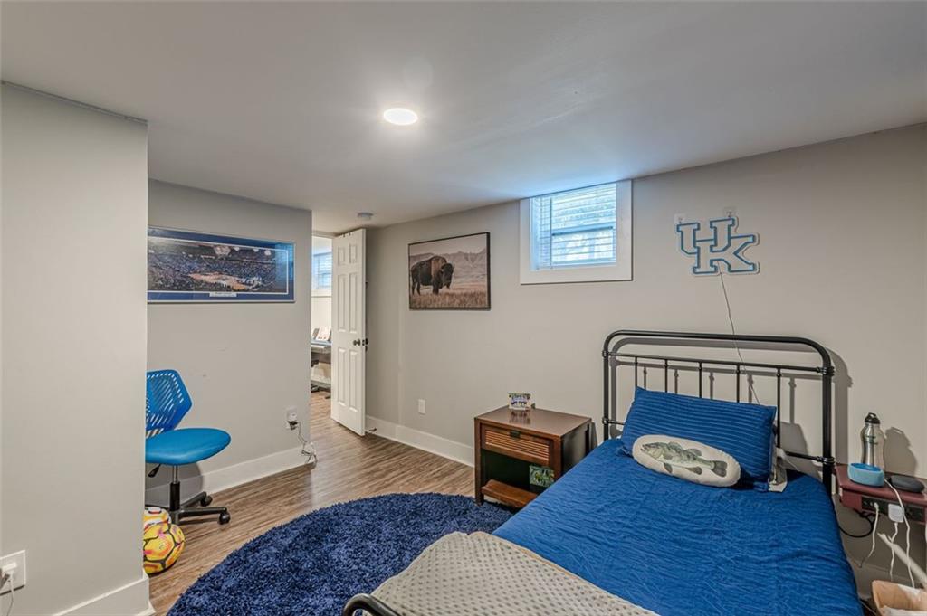 3424 Old Jonesboro Road Atlanta, GA 30354 - Photo 71 of 75 a bedroom with furniture and a wooden floor