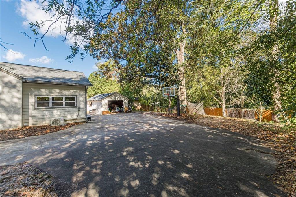 3424 Old Jonesboro Road Atlanta, GA 30354 - Photo 72 of 75 a view of a house with a yard and tree s