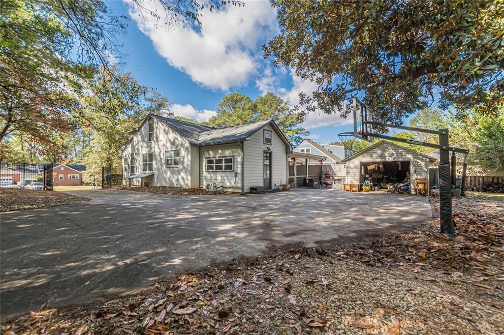 3424 Old Jonesboro Road Atlanta, GA 30354 - Photo 73 of 75 a front view of a house with a yard and garage