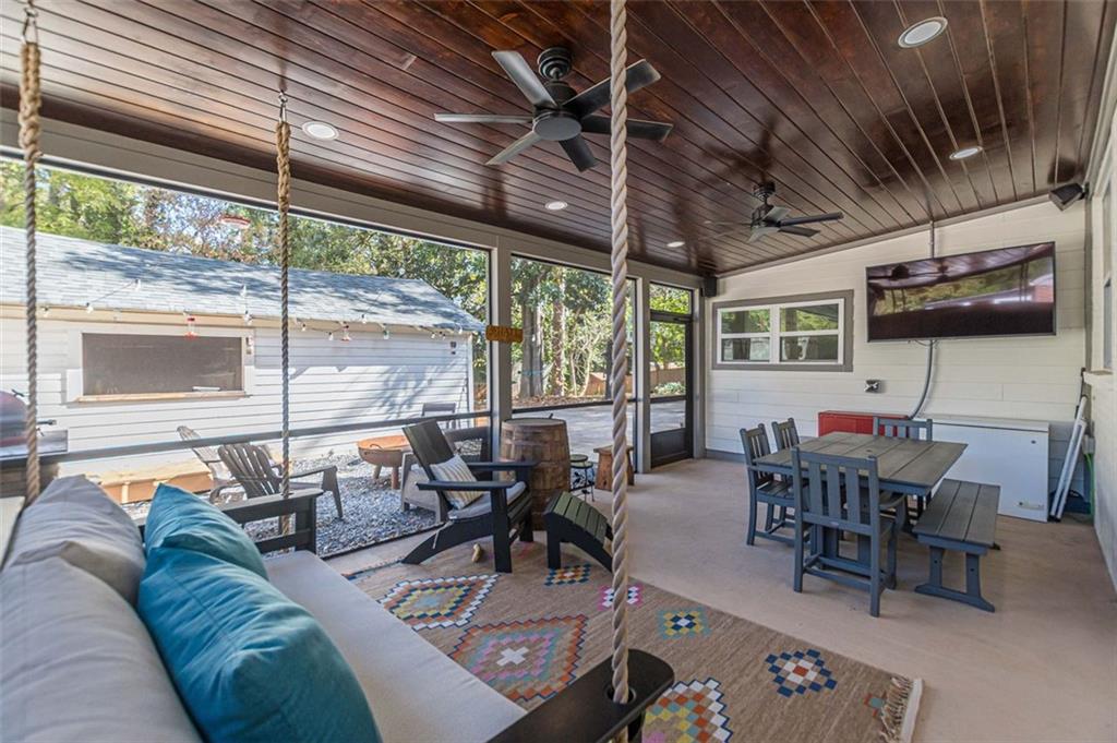 3424 Old Jonesboro Road Atlanta, GA 30354 - Photo 10 of 75 a living room with furniture a flat screen tv and a large window