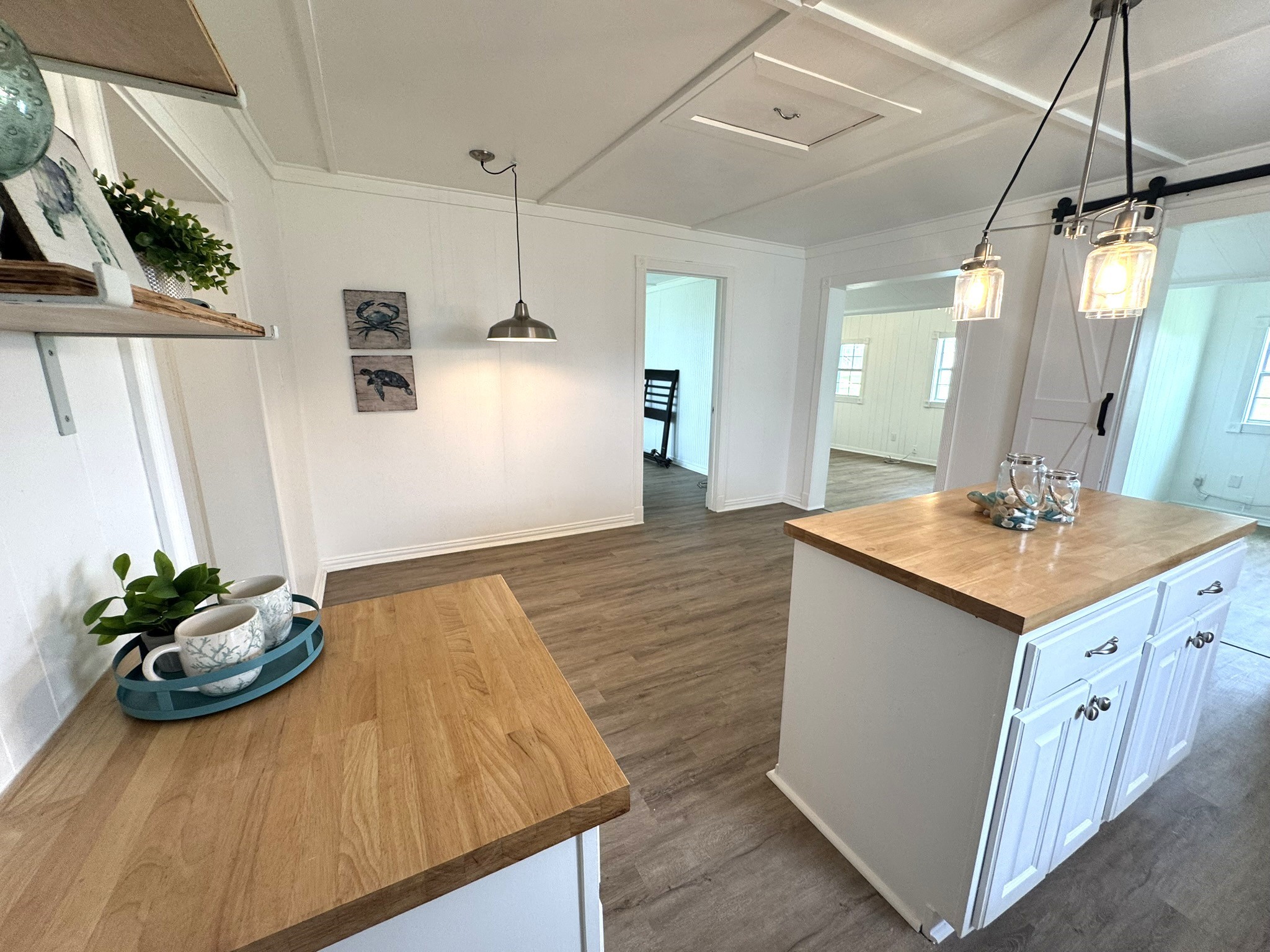 302 2nd Street Palacios, TX 77465 - Photo 20 of 45 a bathroom with a sink a mirror and a potted plant