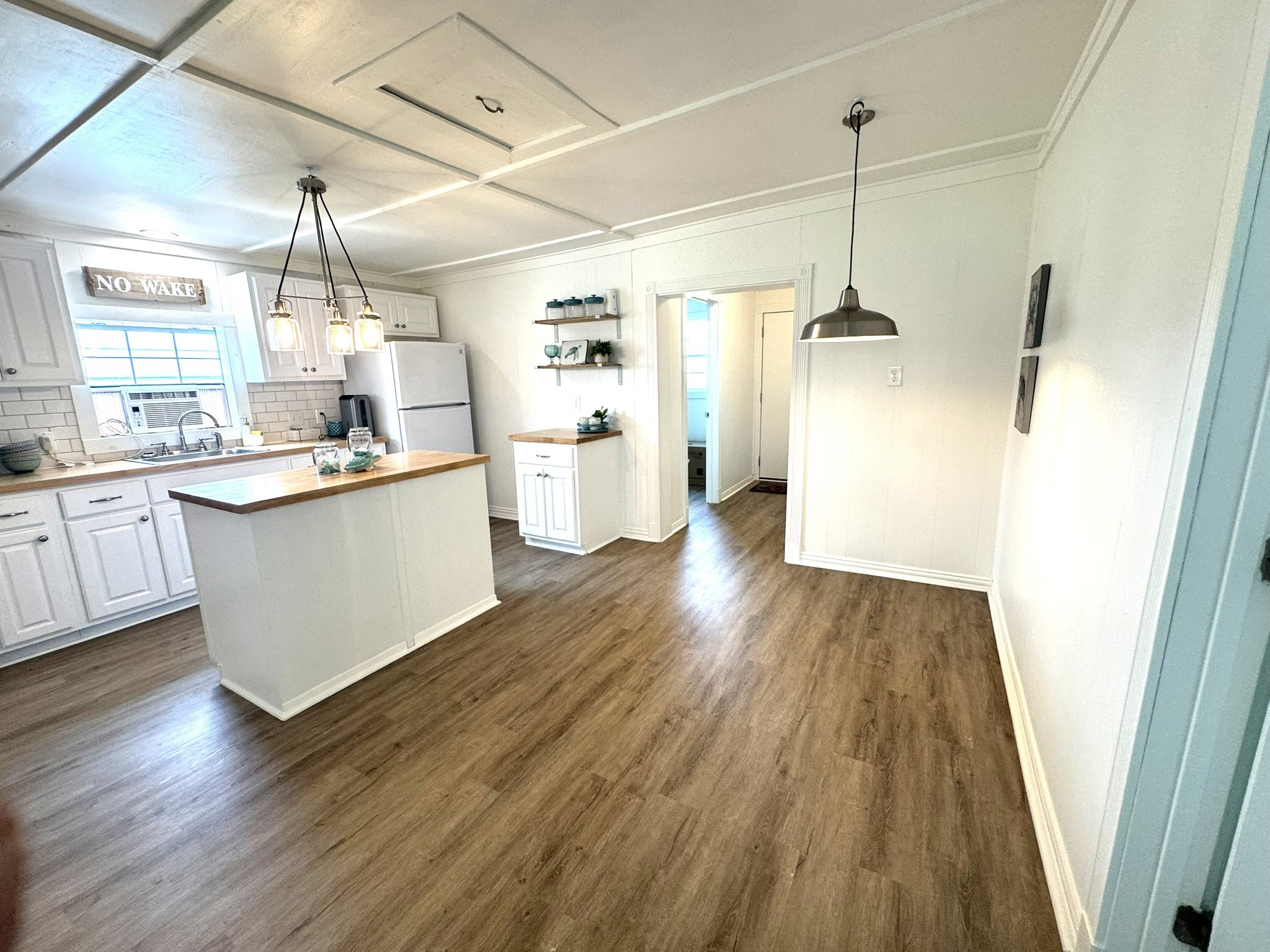 302 2nd Street Palacios, TX 77465 - Photo 23 of 45 a view of a kitchen with wooden floor and window